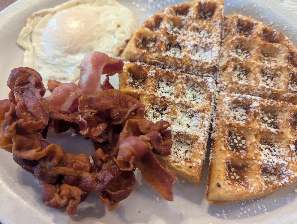 Breakfast menu with eggs and coffee